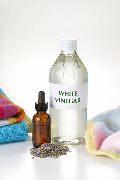 Eco-Friendly Fabric Softener All natural and eco-friendly fabric softener made with White Vinegar and Lavender essential oil. vinegar stock pictures, royalty-free photos & images