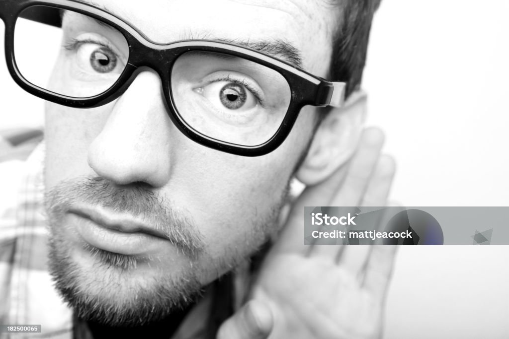 Man with glasses Black and white portrait of male with glasses Listening Stock Photo