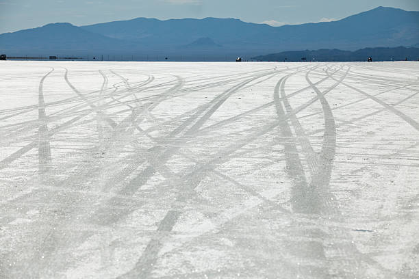 Tire tracks on the salt flats in UT Bonneville Salt Flats Utah USA bonneville salt flats stock pictures, royalty-free photos & images