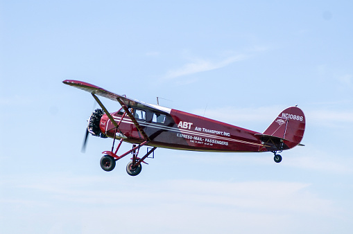Stinson S Junior airplane flying. Built in 1931. Blakesburg, Iowa, USA on August 31, 2008.