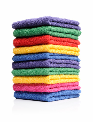 Pile of bright color towels isolated on withe. More in my laundry lightbox below...