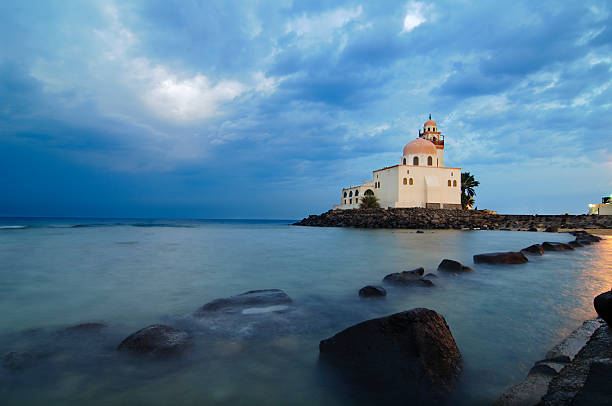 Mosque by Red Sea "Mosque by the Corniche (Red Sea) of Jeddah, Saudi Arabia. This is an unusual photo in the sense that Jeddah hardly gets cloudy." jeddah stock pictures, royalty-free photos & images