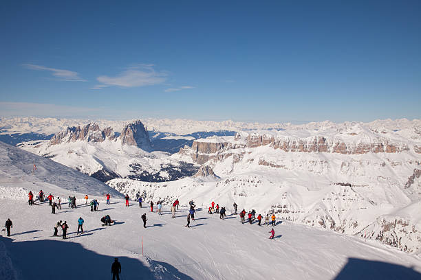 Skiers on the Marmolada Glacier, Dolomites ski resort stock photo