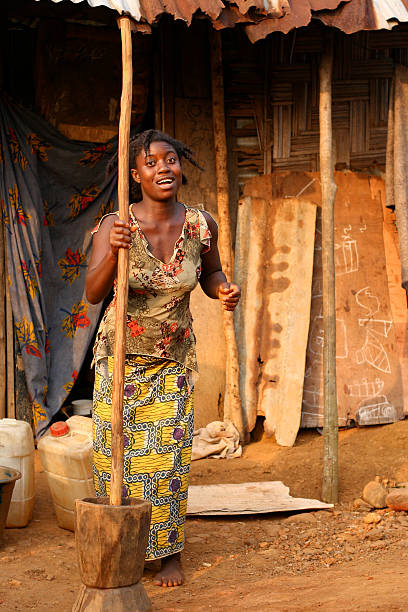 istock African Woman Beating Rice 182501127