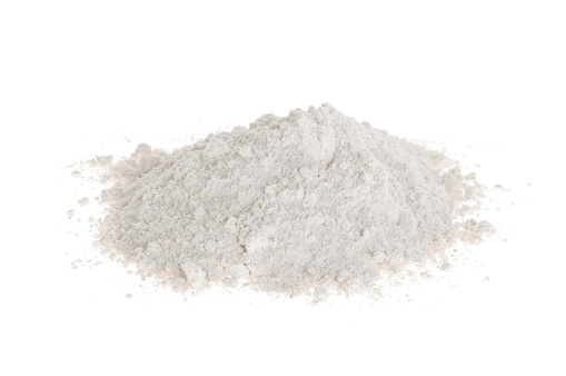 Pile of flour on white background