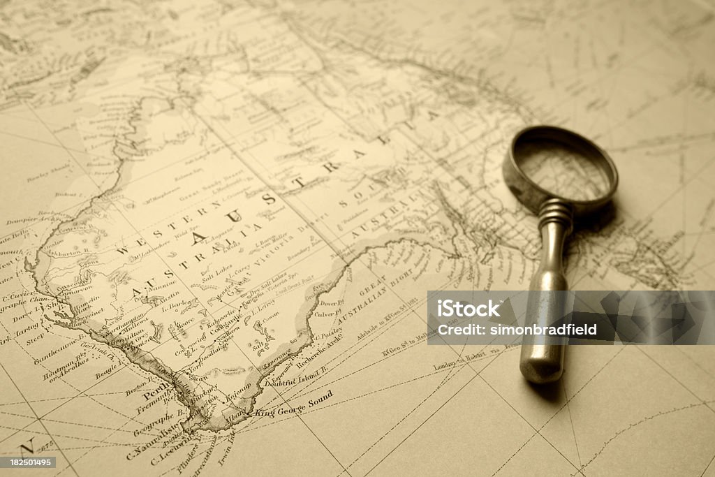 Vintage Map Of Australia "A map of Australia from 1920, complete with magnifying glass. Sepia tinted." Map Stock Photo