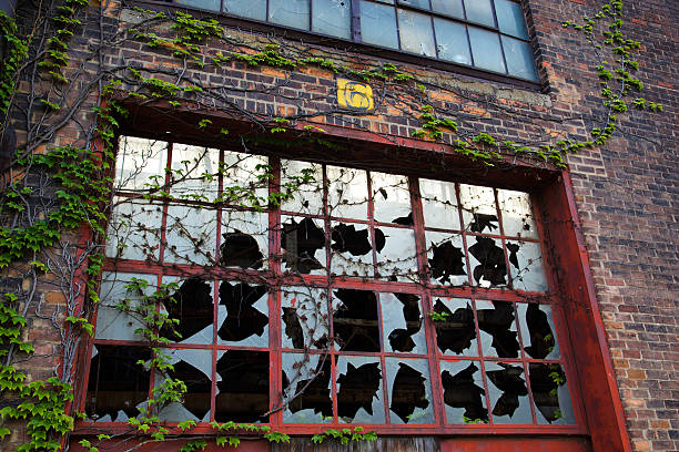 Cracked Window SHipping and receiving painted sign on brick wall of run down warehouse/ factory in downtown Detroit detroit ruins stock pictures, royalty-free photos & images
