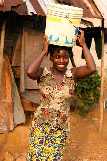 istock African Woman with Bucket 182502129