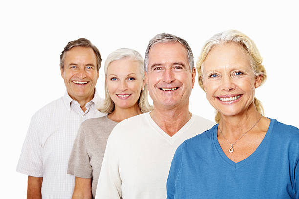 istock Happy elderly couples standing in line against white 182502189