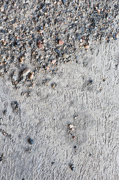 istock Sand and gravel on concrete floor 182502674