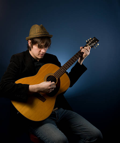 istock Guitarist wearing a hat 182502741