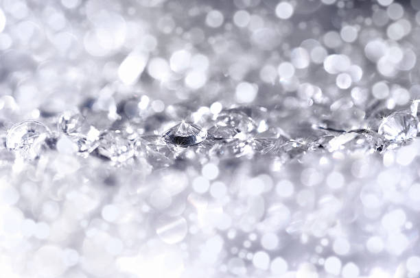Diamonds light Close up of little diamonds, front focus and back are out of focus and generate some beautiful lights. refraction photos stock pictures, royalty-free photos & images