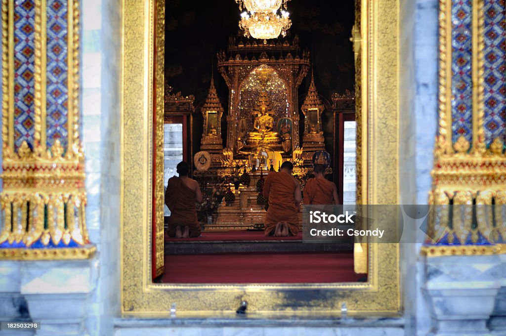 Buddhism Thai temple, Monks praying inside, Bangkok, Thailand. Ancient Stock Photo