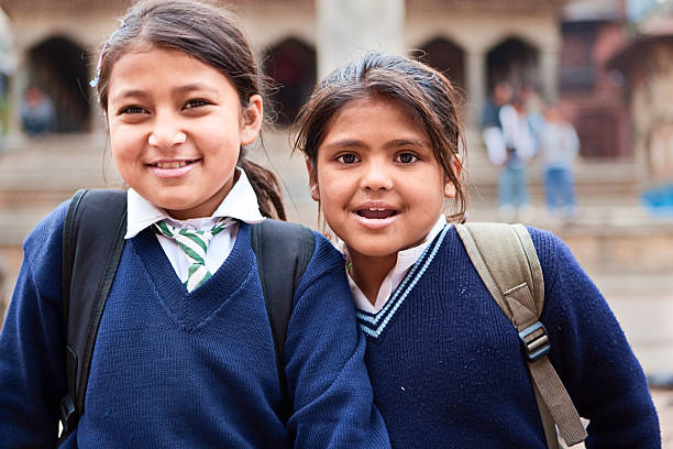 Schoolgirls "Nepali schoolgirls, Durbar Square, Patan." patan durbar square stock pictures, royalty-free photos & images