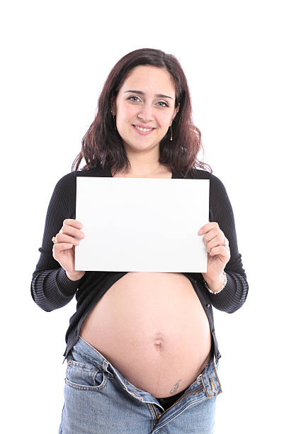 istock Pregnant female holding a blank notice board 182503841