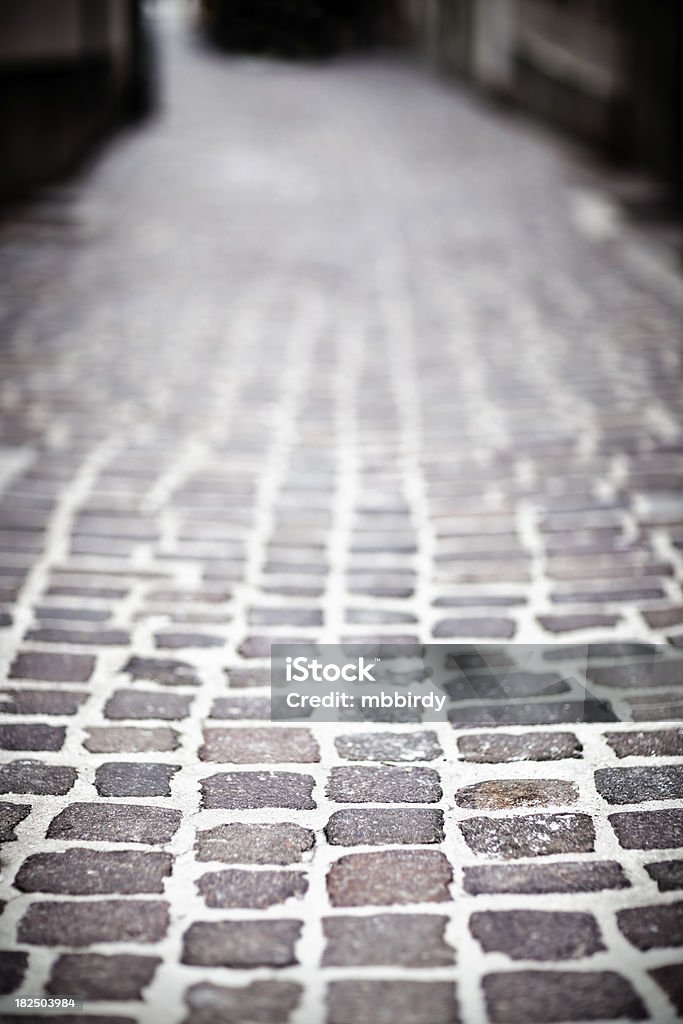 Ulica utwardzonymi skruszonymi granite brukowych - Zbiór zdjęć royalty-free (Abstrakcja)