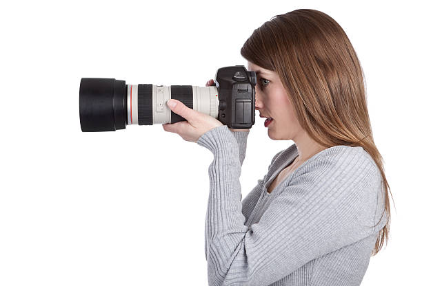 istock Photographer Holding Camera With large Zoom Lens 182504784