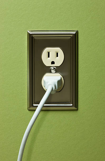 istock Electric grid outlet on green wall 182505076