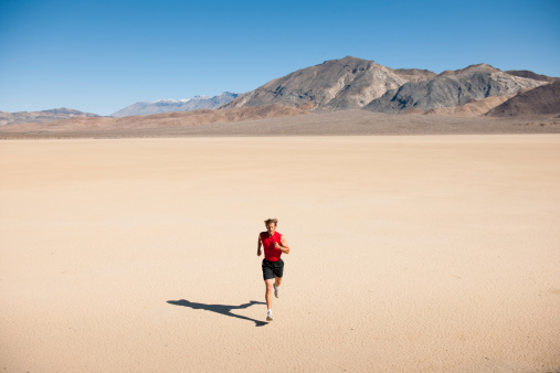 A man running through the vast desert.For more Action Sports images click images below.