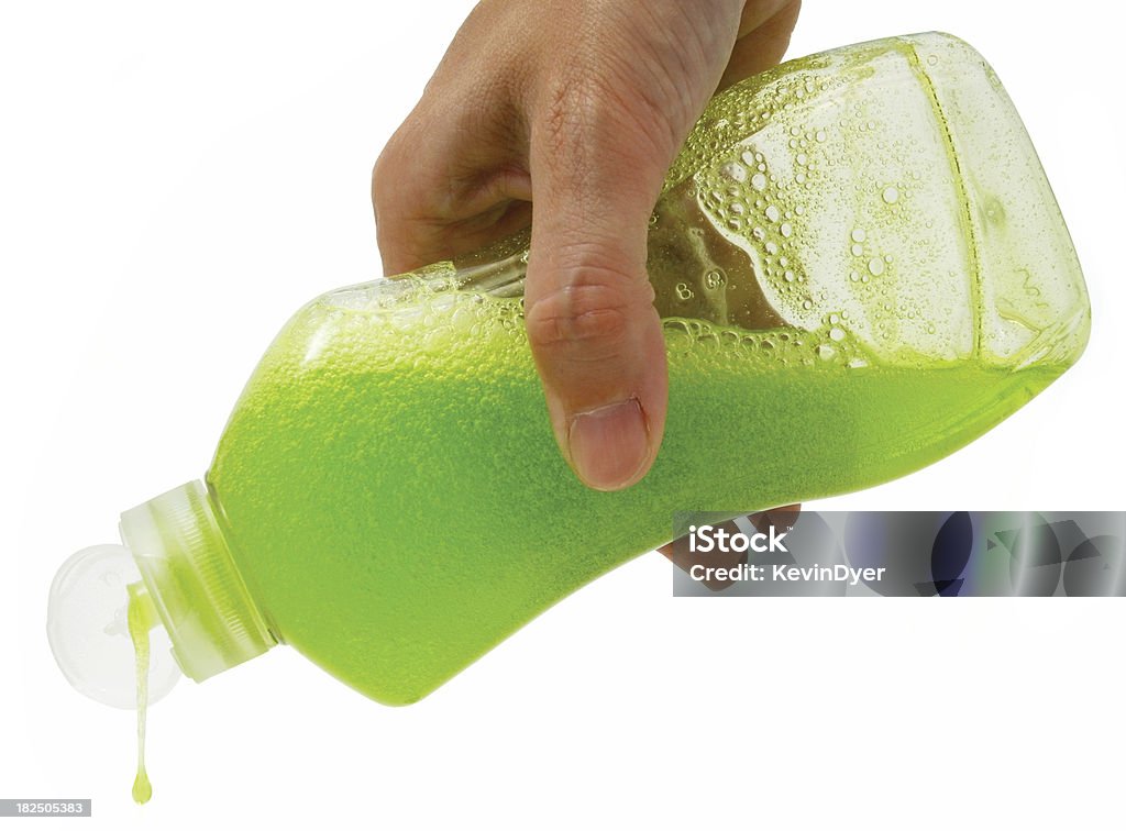 Washing-up Liquid Being Poured Bottle of Green Washing-up Liquid Being Poured Greenwashing Stock Photo