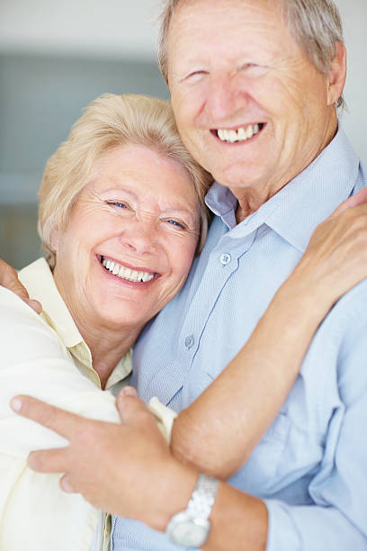 istock Senior couple hugging each other with a smile 182505449