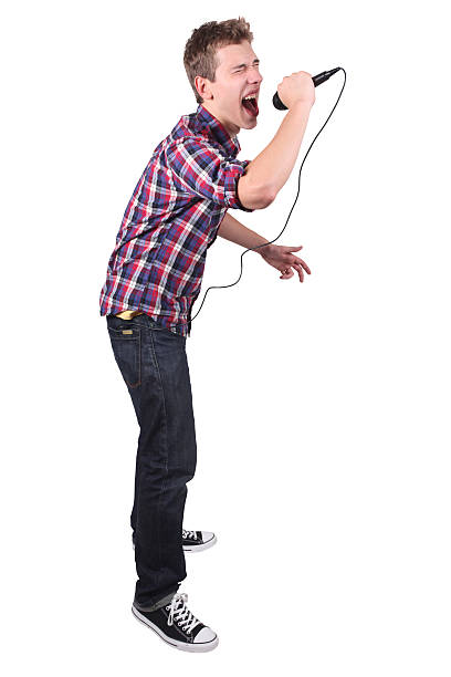 istock Casual young male singing into microphone 182506274