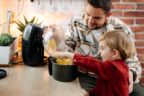istock Teamwork in the kitchen of father and son 1825063576