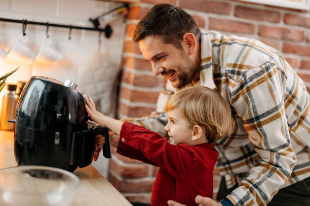 istock Father and son using air fryer 1825064091