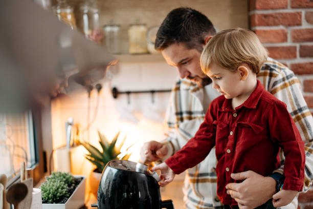 istock Father and son using air fryer 1825064093