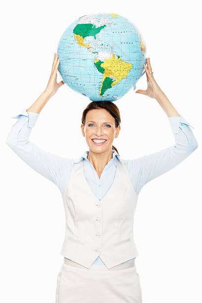 istock Smiling business woman with a globe over head 182506411