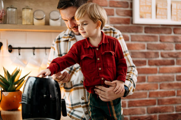 istock Father and son using air fryer 1825065141