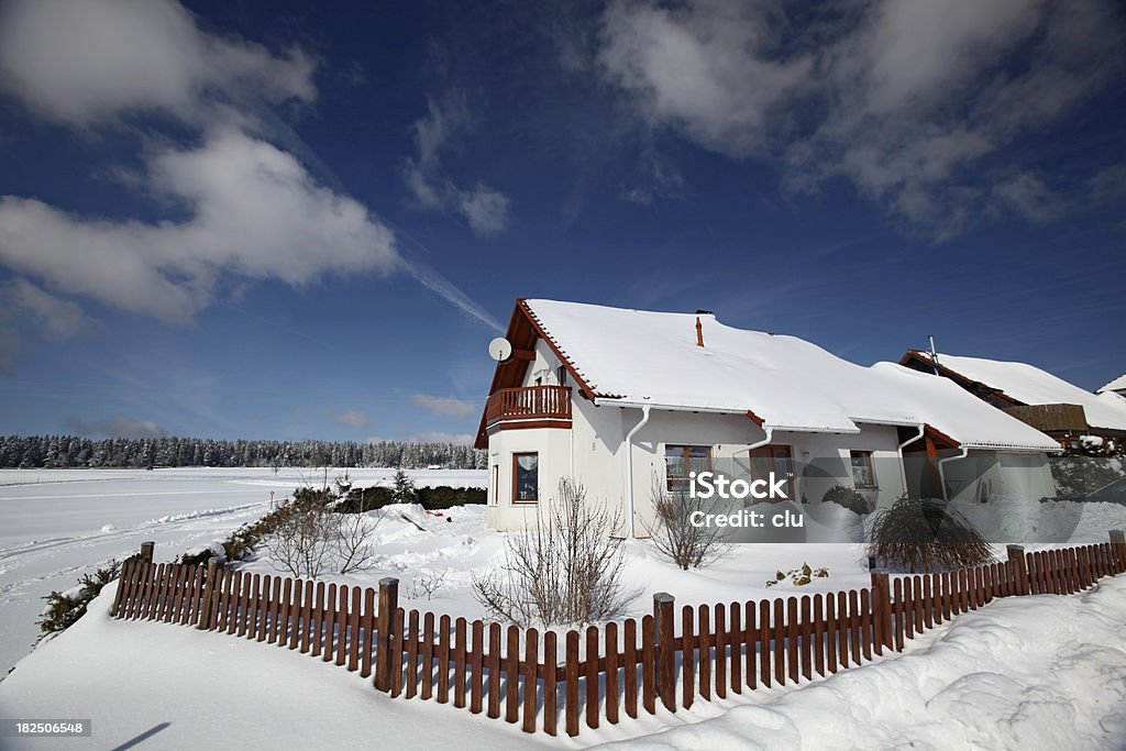 German house in winter landscape and blue sky Horizontal format Rooftop Stock Photo