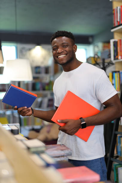 istock Happy young student in a university library, studying with dedication, exuding knowledge and academic happiness. 1825067934