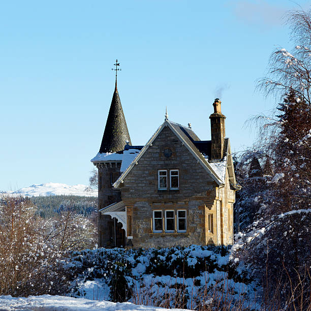 Victorian Gothic Gate Lodge in winter, Speyside, Scottish Highlands stock photo