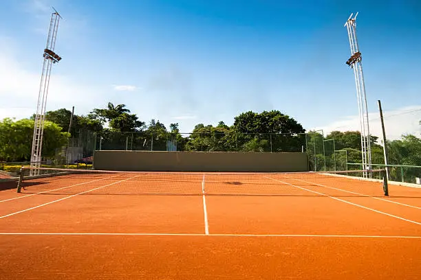 Photo of a tennis court. Tennis net.