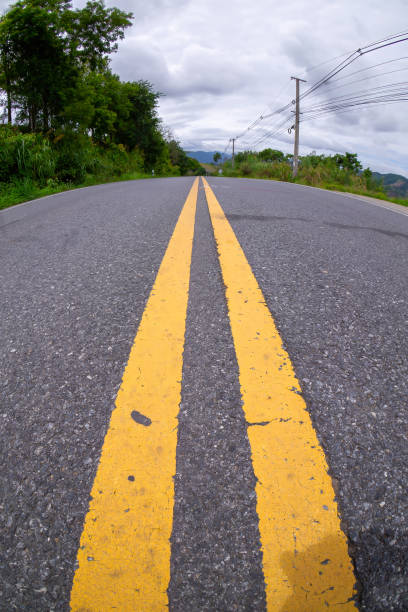 istock yellow lane road dividing line 1825082911