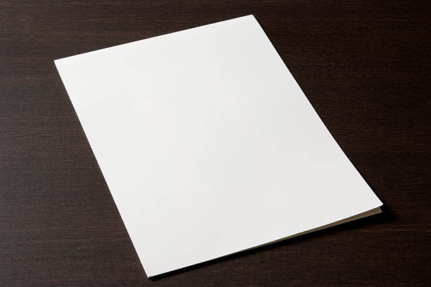 istock Blank document on the wooden desk 182508736