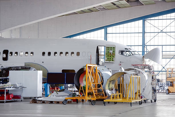 Commercial Airplane Overhaul maintenance inspection of  passenger jet in hangarClick here to view more related images: fuselage stock pictures, royalty-free photos & images