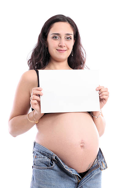 istock Pregnant female holding a blank notice board 182509119