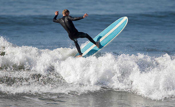 istock Surfer catching a wave at Seal Beach 182509123
