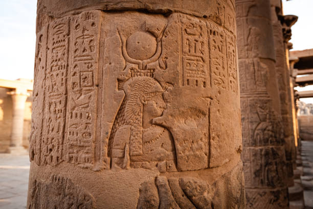Details of Philae temple in Aswan Upper Egypt. Stone carved pillars with Egyptian god images Details of Philae temple in Aswan Upper Egypt. Stone carved pillars with Egyptian god images temple of philae stock pictures, royalty-free photos & images