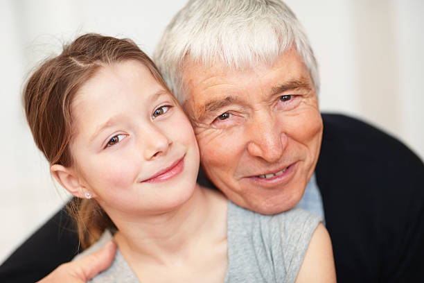 istock Happy granddaughter with grandfather having fun 182509588