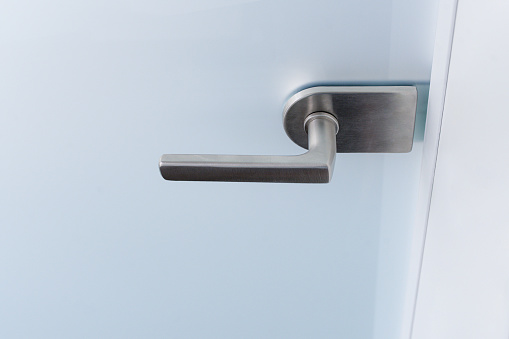 Close-up door stainless door knob, with door open slightly