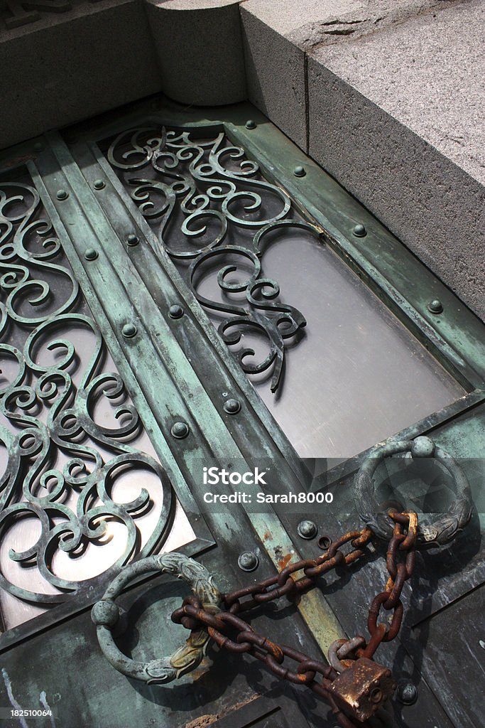 Door of Mausoleum "Old, rusted mausoleum door with lock and chain." Abandoned Stock Photo