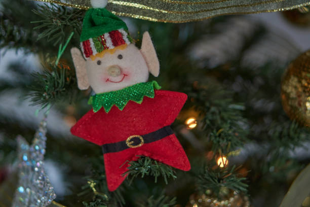 istock decorative miniature star elf in a christmas tree. Flat lay, copy space. 1825102309