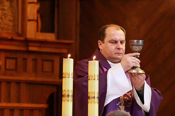 istock Clergy and chalice 182510571