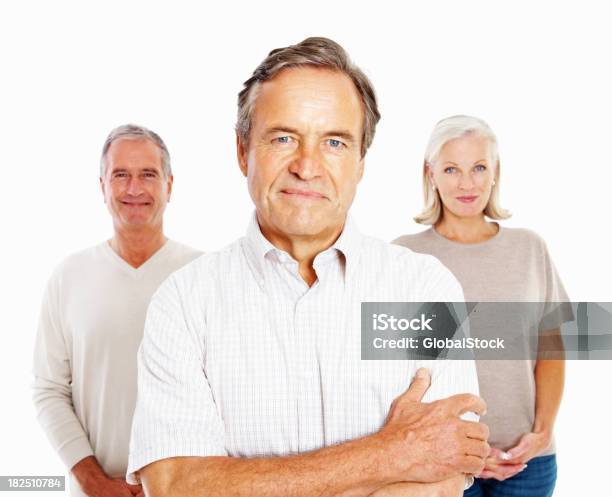 Happy Senior Men And Woman Standing Together Against White Stock Photo - Download Image Now