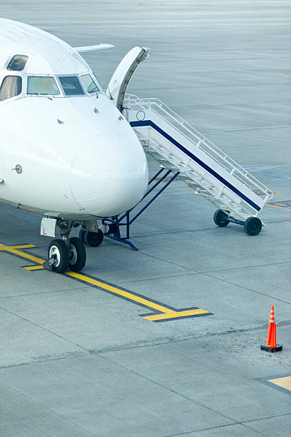 istock Airplane with gangway waiting for the passengers 182510945