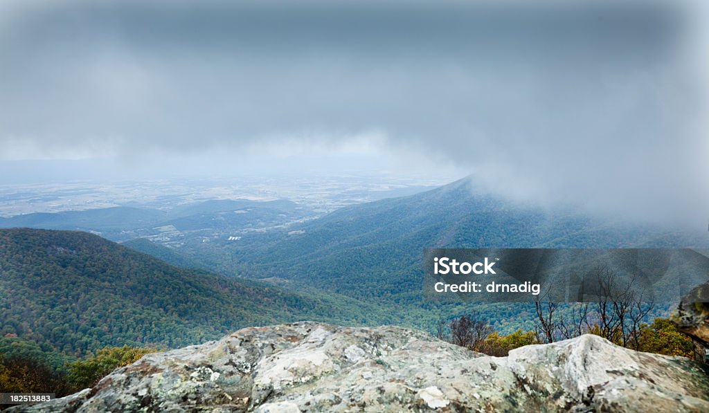 Clouds Rolling in over the Blue Ridge Storm clouds rolling in over the mountains as viewed from the summit of Hawksbill Mountain, the highest point in Shenandoah National Park. Appalachia Stock Photo