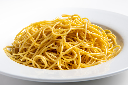 Plain Spaghetti pasta close up on white background